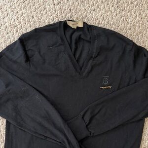 Burberry black Marina wool top with Burberry Pin. Approximately a size 8